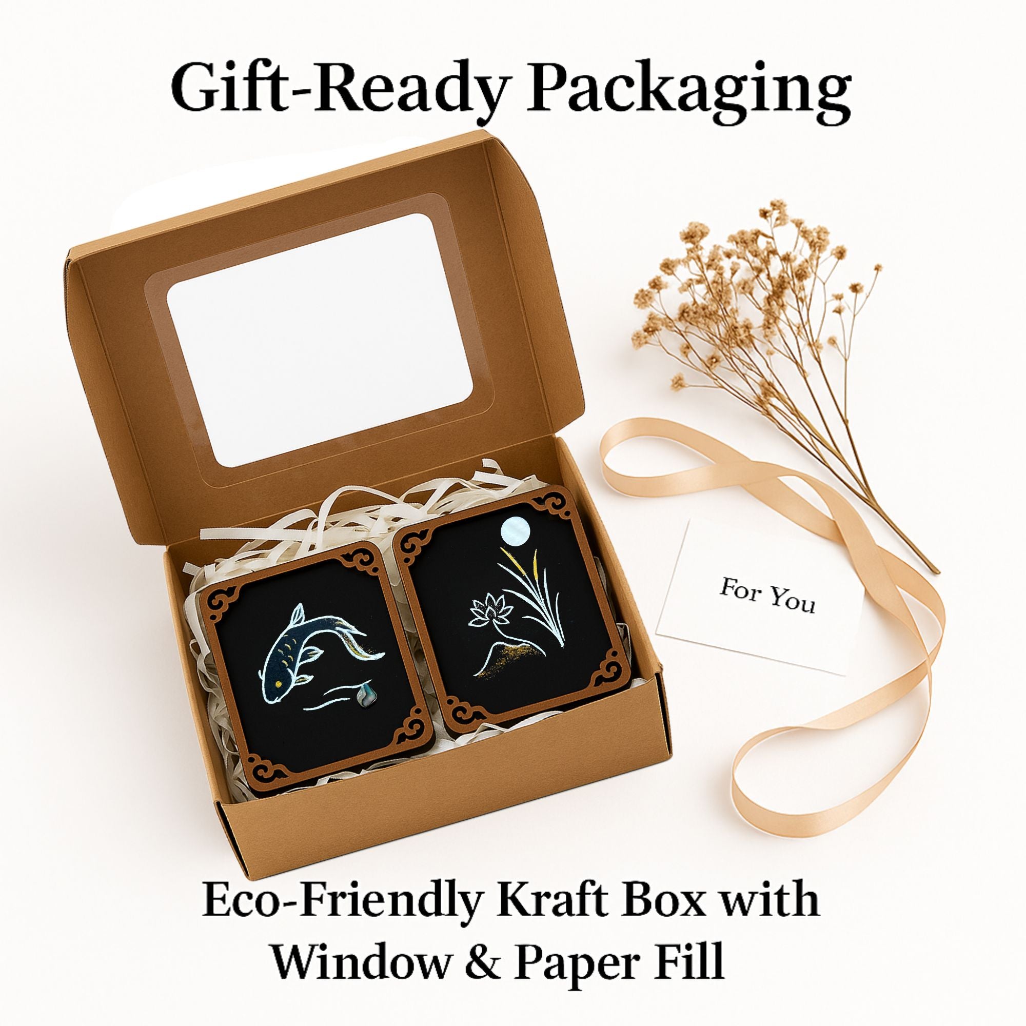 Gift-ready eco-friendly kraft box with window and paper fill, containing 2 hand-painted Totem Collection art cards featuring koi fish, lotus, and moon designs.