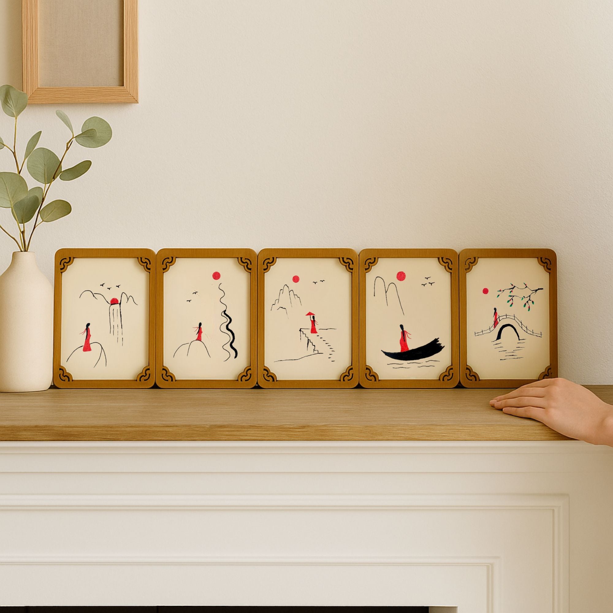 Set of five hand-painted wooden cards with oriental minimalist art, neatly arranged on a wooden surface for a complete series display.